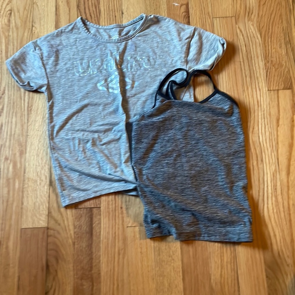 two athlete shirts, one T-shirt and the other tank top.
